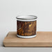 Front View Custom Dillon Montana Map Enamel Mug in Ember on Cutting Board