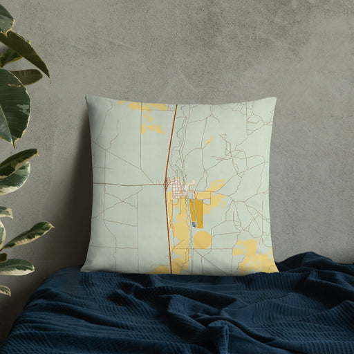 Custom Dubois Idaho Map Throw Pillow in Woodblock on Bedding Against Wall