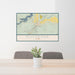 24x36 Duchesne Utah Map Print Lanscape Orientation in Woodblock Style Behind 2 Chairs Table and Potted Plant