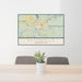 24x36 Eatonville Washington Map Print Lanscape Orientation in Woodblock Style Behind 2 Chairs Table and Potted Plant