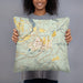 Person holding 18x18 Custom Eatonville Washington Map Throw Pillow in Woodblock
