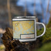 Right View Custom Eldon Missouri Map Enamel Mug in Woodblock on Grass With Trees in Background