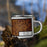 Right View Custom Elk City Oklahoma Map Enamel Mug in Ember on Grass With Trees in Background