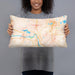 Person holding 20x12 Custom Elk River Minnesota Map Throw Pillow in Watercolor