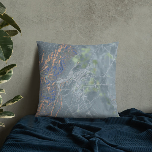 Custom Ely Nevada Map Throw Pillow in Afternoon on Bedding Against Wall