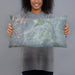 Person holding 20x12 Custom Ely Nevada Map Throw Pillow in Afternoon