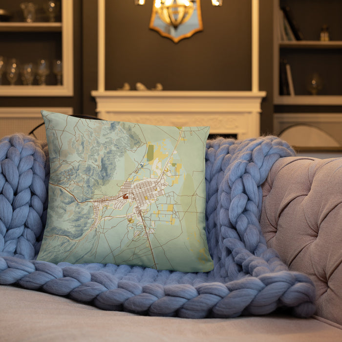 Custom Ely Nevada Map Throw Pillow in Woodblock on Cream Colored Couch