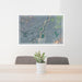24x36 Emigrant Montana Map Print Landscape Orientation in Afternoon Style Behind 2 Chairs Table and Potted Plant