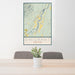 24x36 Emigrant Montana Map Print Portrait Orientation in Woodblock Style Behind 2 Chairs Table and Potted Plant
