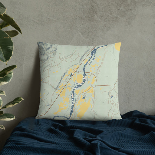 Custom Emigrant Montana Map Throw Pillow in Woodblock on Bedding Against Wall