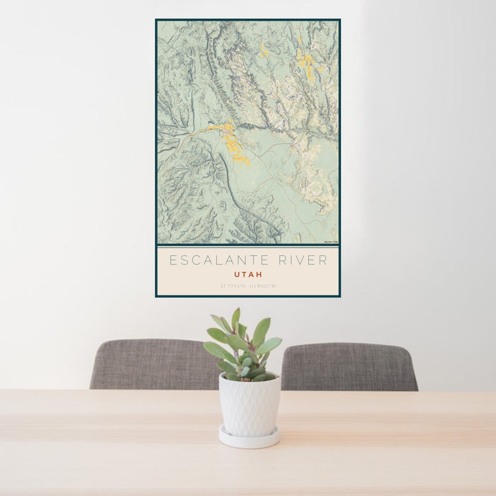 24x36 Escalante River Utah Map Print Portrait Orientation in Woodblock Style Behind 2 Chairs Table and Potted Plant