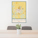 24x36 Fairfield Iowa Map Print Portrait Orientation in Woodblock Style Behind 2 Chairs Table and Potted Plant