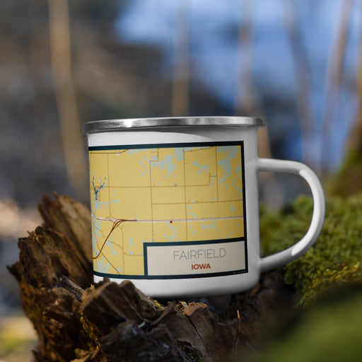 Right View Custom Fairfield Iowa Map Enamel Mug in Woodblock on Grass With Trees in Background