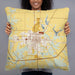 Person holding 22x22 Custom Fairfield Iowa Map Throw Pillow in Woodblock