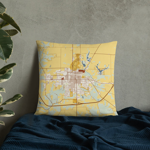 Custom Fairfield Iowa Map Throw Pillow in Woodblock on Bedding Against Wall