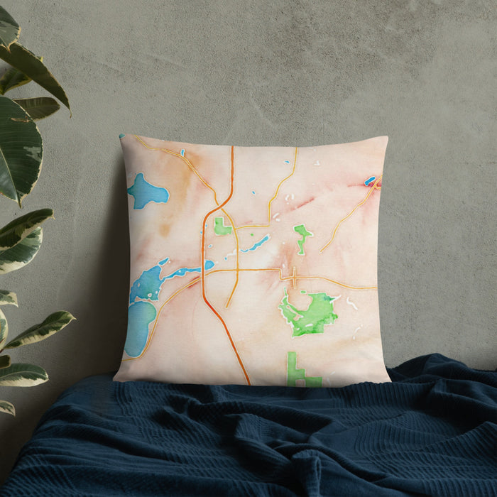 Custom Faribault Minnesota Map Throw Pillow in Watercolor on Bedding Against Wall
