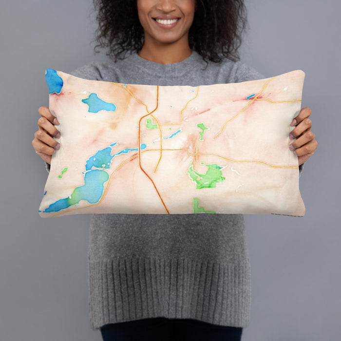 Person holding 20x12 Custom Faribault Minnesota Map Throw Pillow in Watercolor