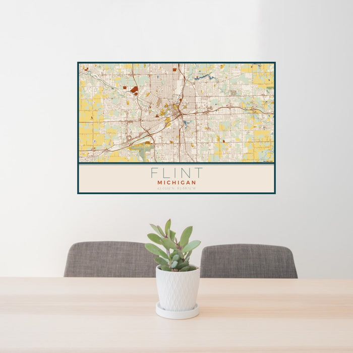 24x36 Flint Michigan Map Print Lanscape Orientation in Woodblock Style Behind 2 Chairs Table and Potted Plant