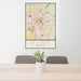 24x36 Flint Michigan Map Print Portrait Orientation in Woodblock Style Behind 2 Chairs Table and Potted Plant