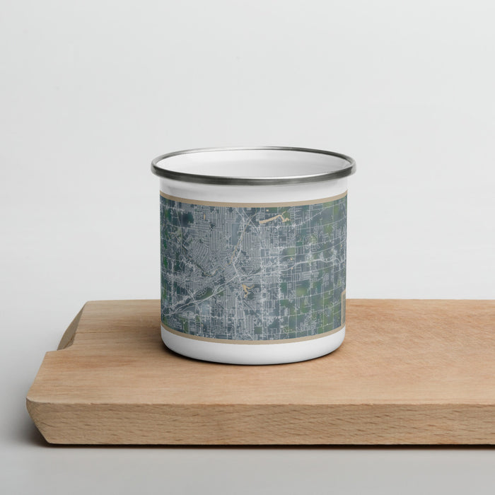 Front View Custom Flint Michigan Map Enamel Mug in Afternoon on Cutting Board