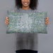 Person holding 20x12 Custom Flint Michigan Map Throw Pillow in Afternoon