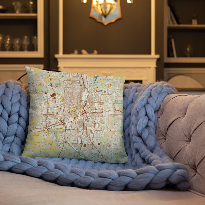Custom Flint Michigan Map Throw Pillow in Woodblock on Cream Colored Couch