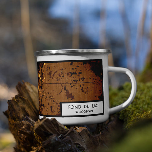 Right View Custom Fond du Lac Wisconsin Map Enamel Mug in Ember on Grass With Trees in Background