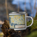 Right View Custom Forest Lake Minnesota Map Enamel Mug in Woodblock on Grass With Trees in Background