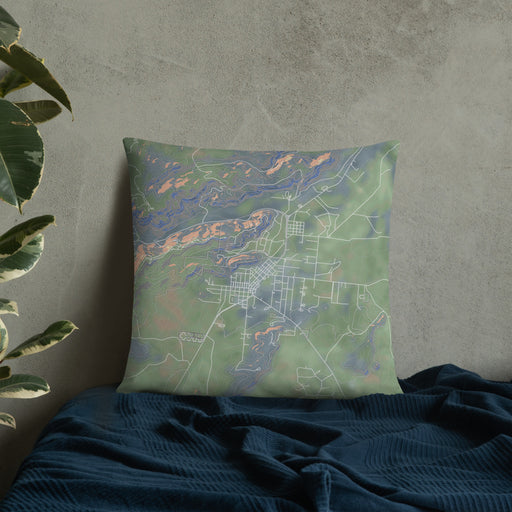 Custom Fort Davis Texas Map Throw Pillow in Afternoon on Bedding Against Wall