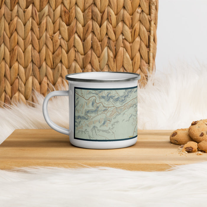 Left View Custom Fort Davis Texas Map Enamel Mug in Woodblock on Table Top