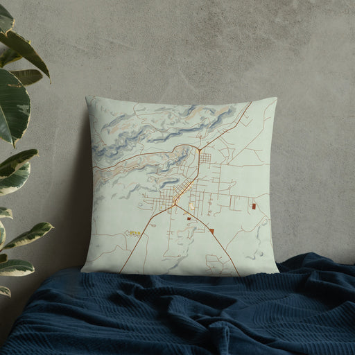 Custom Fort Davis Texas Map Throw Pillow in Woodblock on Bedding Against Wall