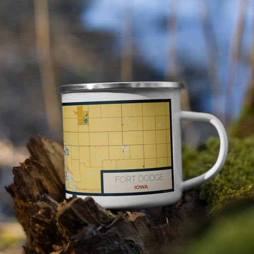 Right View Custom Fort Dodge Iowa Map Enamel Mug in Woodblock on Grass With Trees in Background