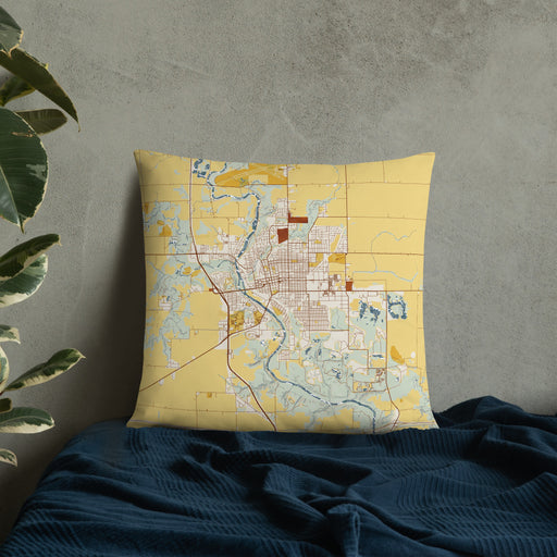 Custom Fort Dodge Iowa Map Throw Pillow in Woodblock on Bedding Against Wall