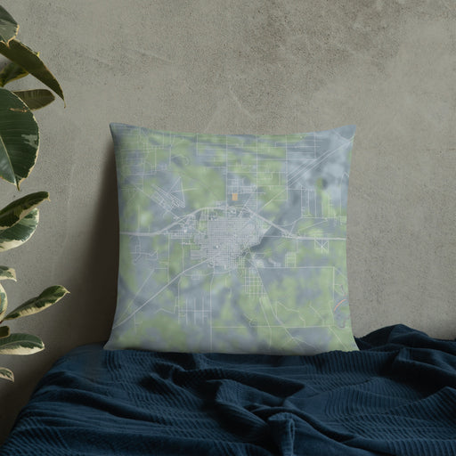 Custom Fort Stockton Texas Map Throw Pillow in Afternoon on Bedding Against Wall