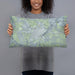 Person holding 20x12 Custom Fort Stockton Texas Map Throw Pillow in Afternoon