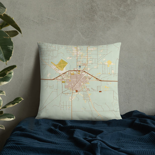 Custom Fort Stockton Texas Map Throw Pillow in Woodblock on Bedding Against Wall