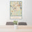 24x36 Framingham Massachusetts Map Print Portrait Orientation in Woodblock Style Behind 2 Chairs Table and Potted Plant