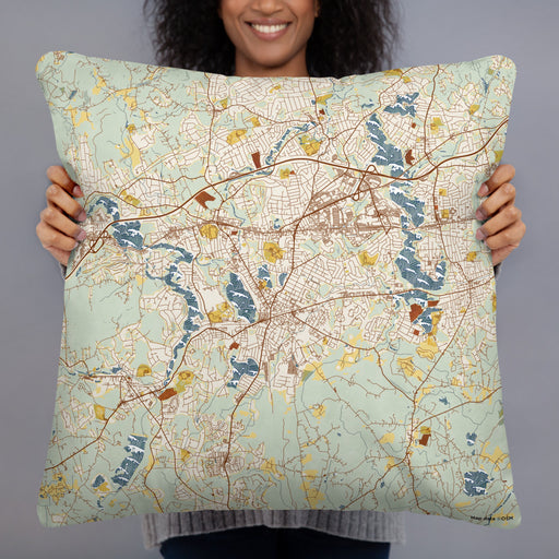 Person holding 22x22 Custom Framingham Massachusetts Map Throw Pillow in Woodblock