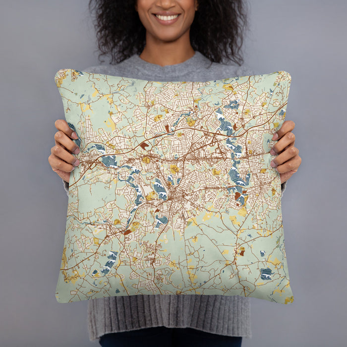 Person holding 18x18 Custom Framingham Massachusetts Map Throw Pillow in Woodblock