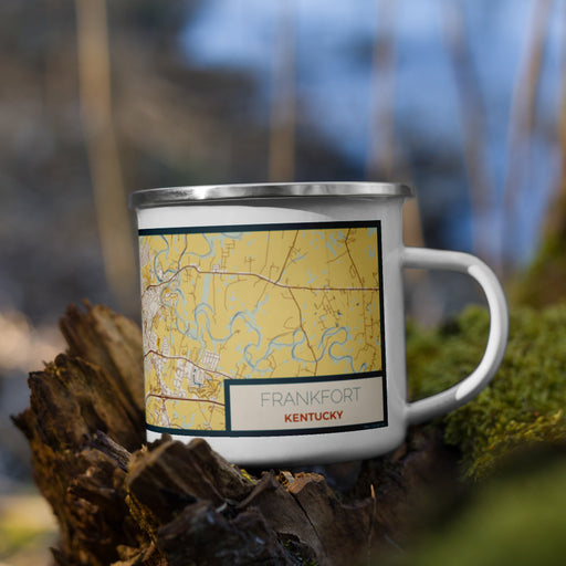 Right View Custom Frankfort Kentucky Map Enamel Mug in Woodblock on Grass With Trees in Background