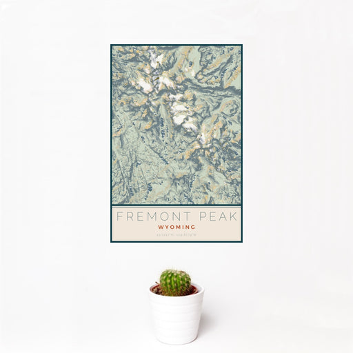 12x18 Fremont Peak Wyoming Map Print Portrait Orientation in Woodblock Style With Small Cactus Plant in White Planter