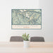 24x36 Fremont Peak Wyoming Map Print Lanscape Orientation in Woodblock Style Behind 2 Chairs Table and Potted Plant