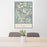 24x36 Fremont Peak Wyoming Map Print Portrait Orientation in Woodblock Style Behind 2 Chairs Table and Potted Plant