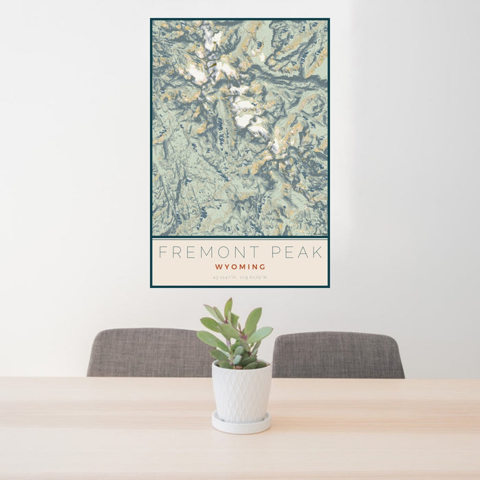 24x36 Fremont Peak Wyoming Map Print Portrait Orientation in Woodblock Style Behind 2 Chairs Table and Potted Plant