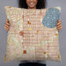 Person holding 22x22 Custom Fulton Minnesota Map Throw Pillow in Woodblock