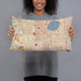 Person holding 20x12 Custom Fulton Minnesota Map Throw Pillow in Woodblock