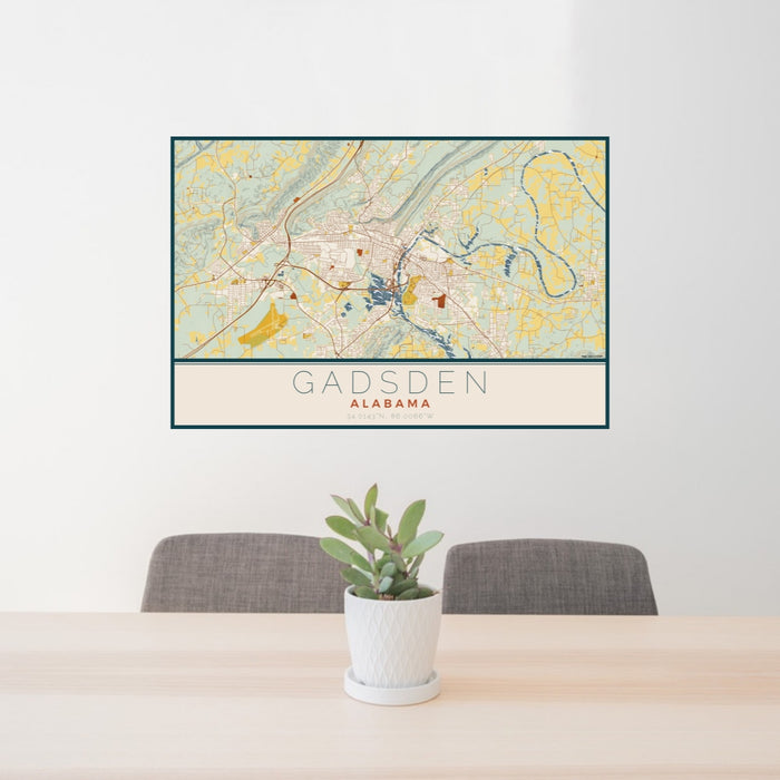 24x36 Gadsden Alabama Map Print Lanscape Orientation in Woodblock Style Behind 2 Chairs Table and Potted Plant