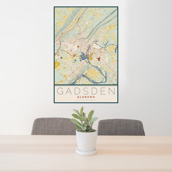 24x36 Gadsden Alabama Map Print Portrait Orientation in Woodblock Style Behind 2 Chairs Table and Potted Plant