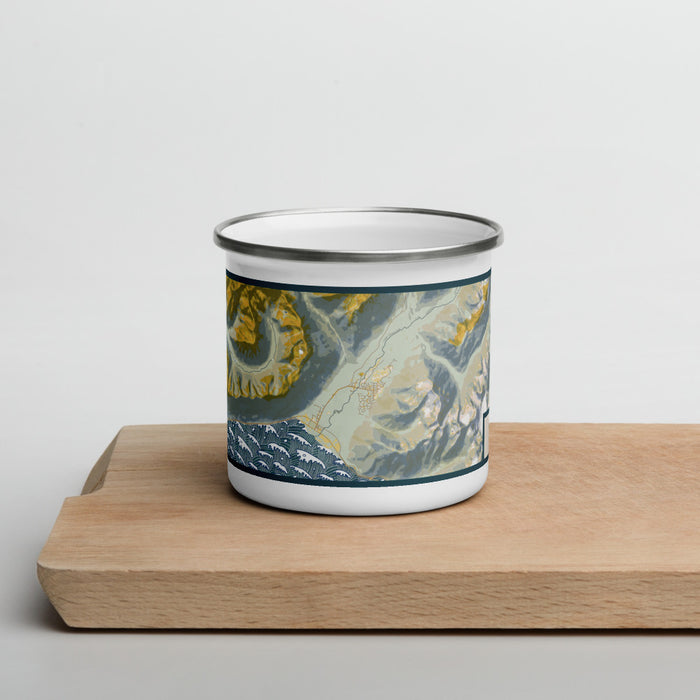 Front View Custom Girdwood Alaska Map Enamel Mug in Woodblock on Cutting Board