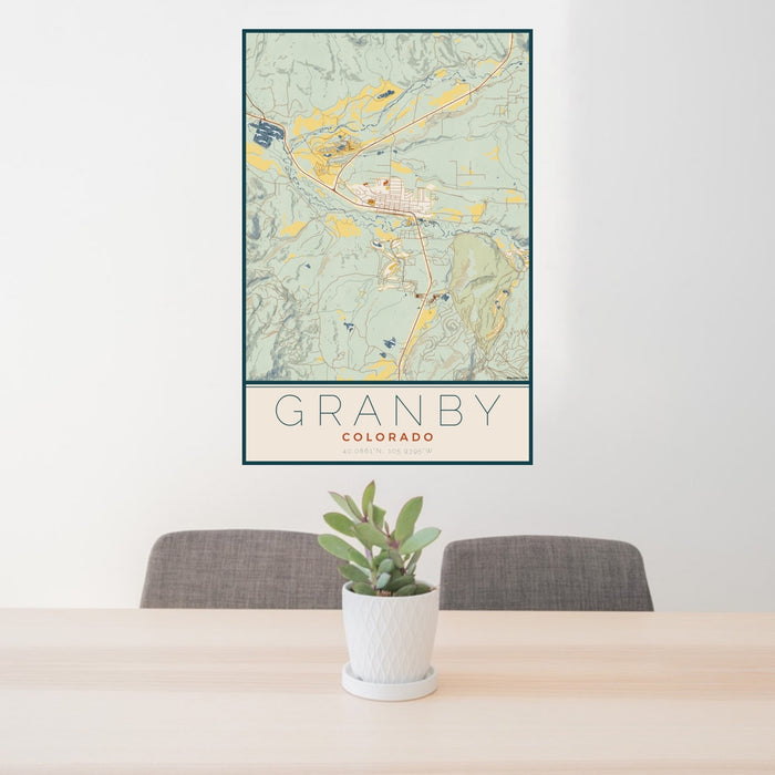 24x36 Granby Colorado Map Print Portrait Orientation in Woodblock Style Behind 2 Chairs Table and Potted Plant